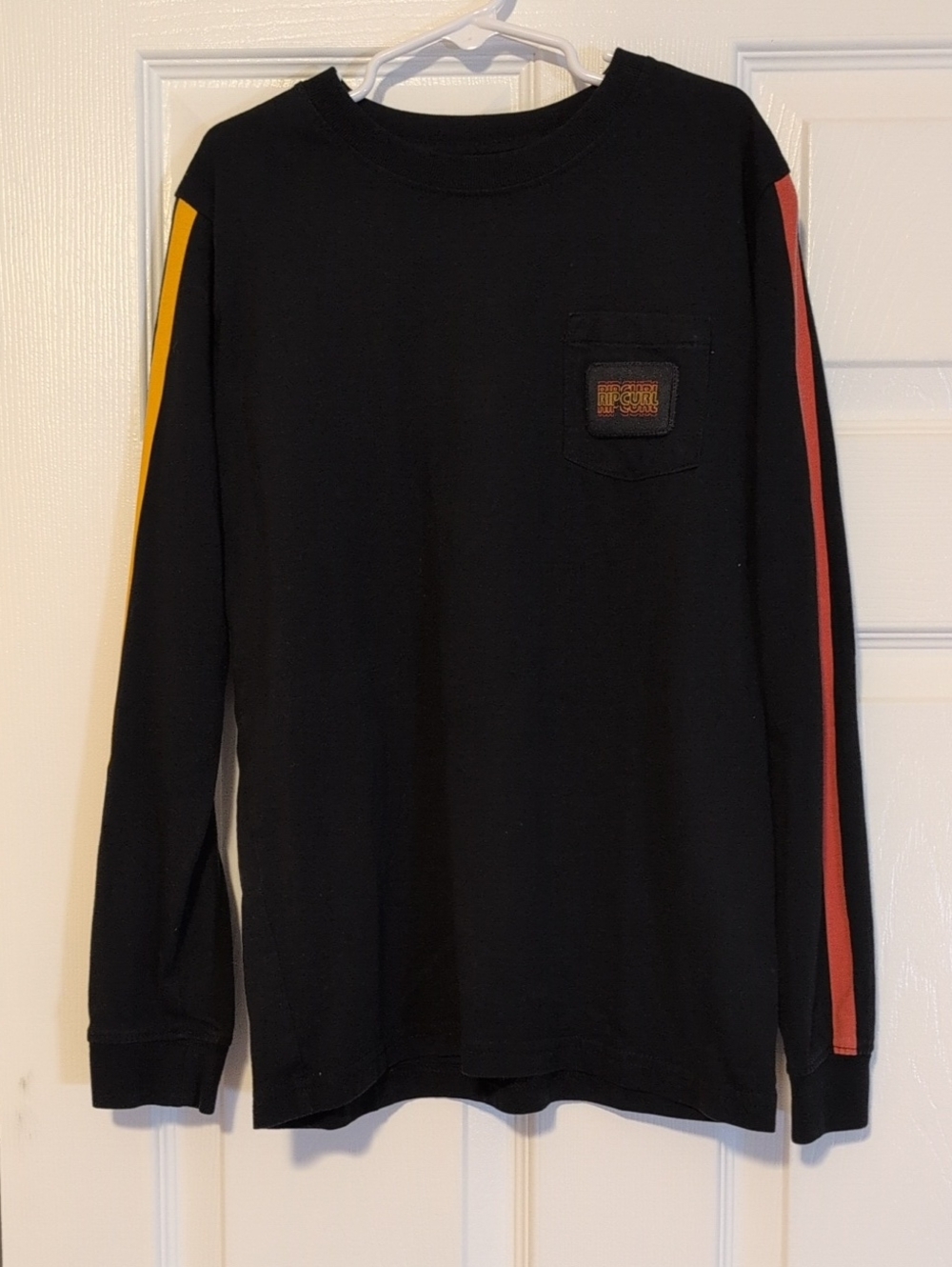 Rip Curl Boys Black Long Sleeve Tee with Yellow and Red Sleeve Stripes